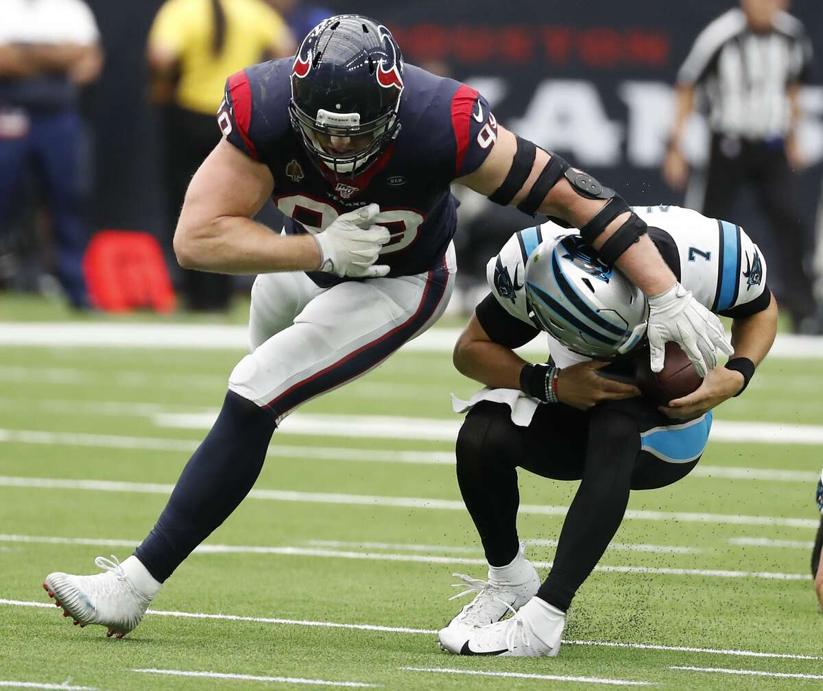 Houston Texans defensive end J.J. Watt (99) misses a sack of Carolina Panthers quarterback Kyle Allen (7), as Allen ducks under Watt and then threw for a first down, during an NFL football game at NRG Stadium on Sunday, Sept. 29, 2019, in Houston.