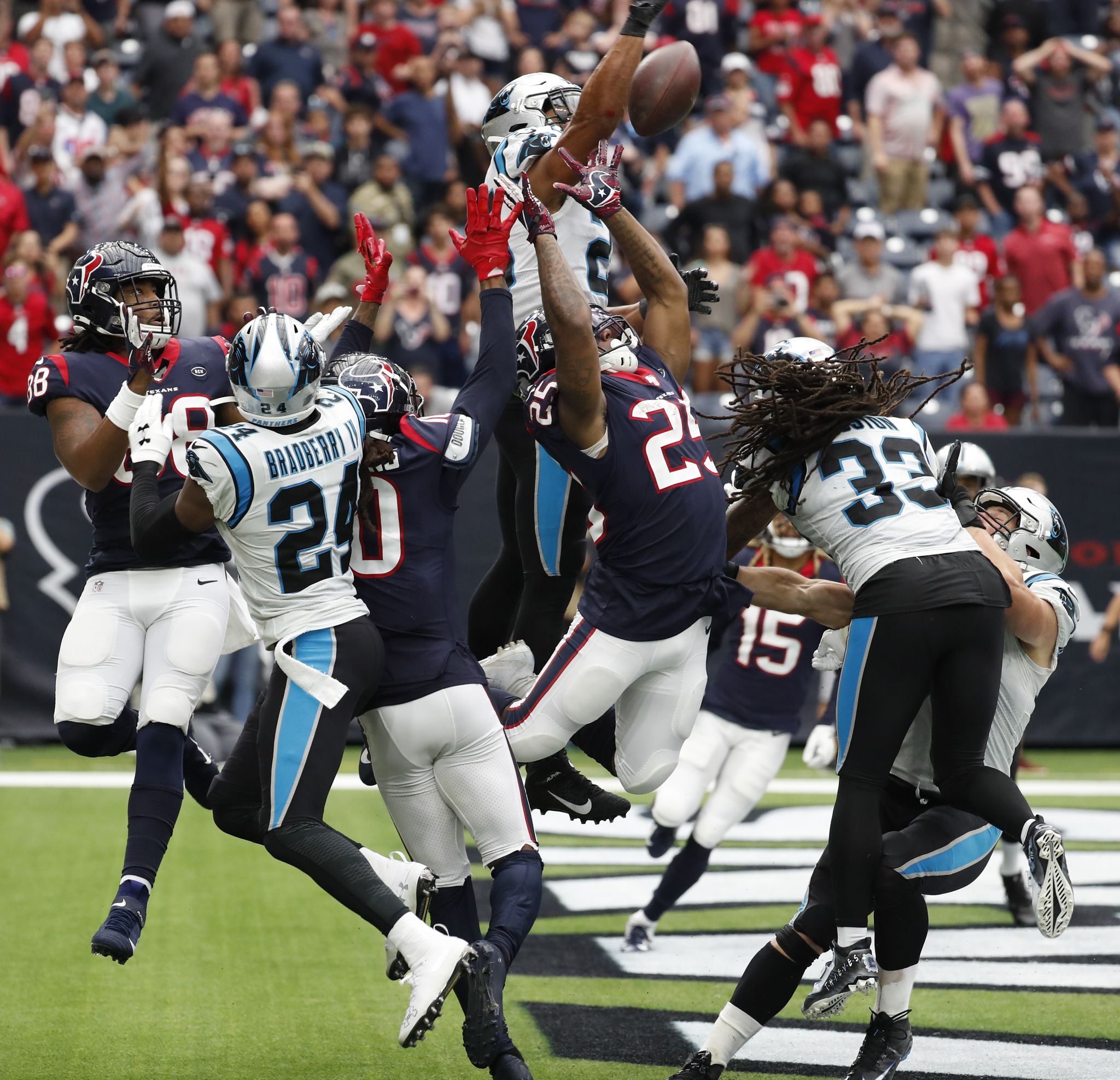 Carolina Panthers safety Eric Reid, right, exchanges his game jersey with  his brother Houston Texans safety Justin Reid at the end of their game at  NRG Stadium in Houston on Sunday, Sept.