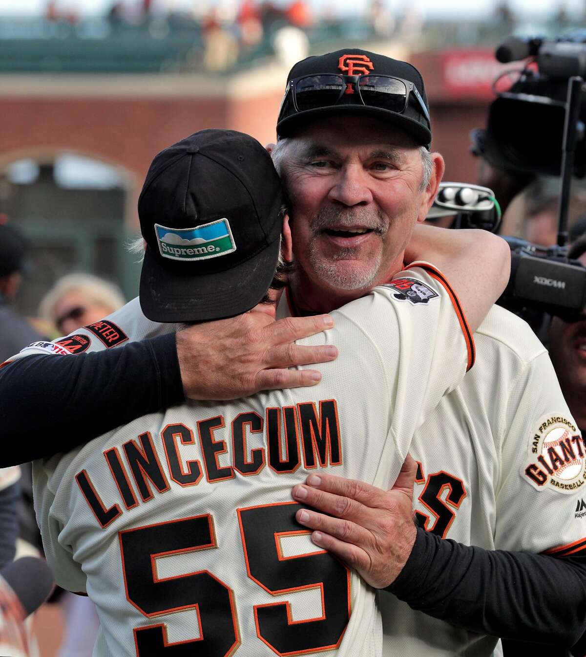 Giants manager Bruce Bochy hugs Tim Lincecum followning an onfield ceremony honoring Bochy after managed his final game with the San Francisco Giants at Oracle Park in San Francisco, Calif., on Sunday, September 29, 2019.