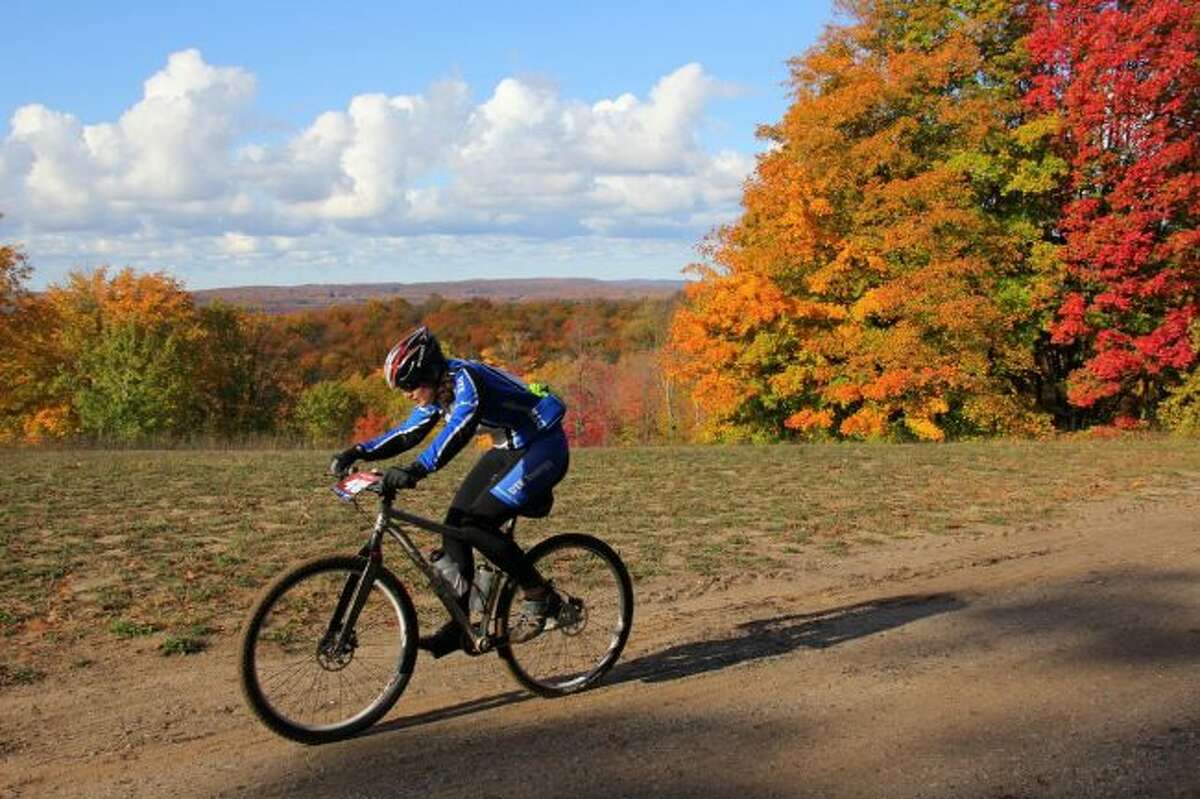 Riding a bike along one of the area's plentiful trails is a good way to see fall's brilliant colors. (File Photo)