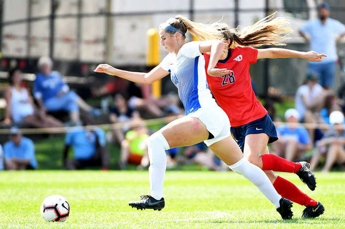 Saint Louis University’s Annabelle Copeland, left, drives the ball against Dayton’s Audrey Steiert Sunday at Hermann Stadium. A junior from Marquette Catholic High, Copeland scored a pair of goals to lead the Billikens to a 4-1 victory.