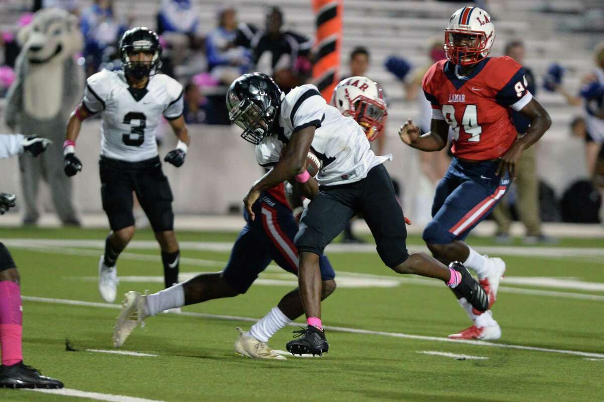 Quarterback Akeem Benjamin (7) of Westside scrambles for a touchdown in the fourth quarter of a high school football game between the Lamar Texans and the Westside Wolves on Friday, October 5, 2018 at Delmar Stadium, Houston, TX.