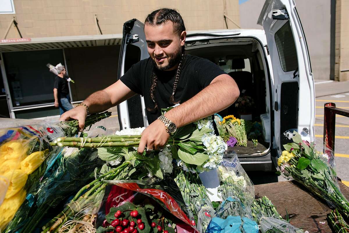 Maurice Sharif of East Bay Flowers in San Leandro loads up a van with flowers at the San Francisco Flower Mart in San Francisco, Calif, on Monday, September 30, 2019.