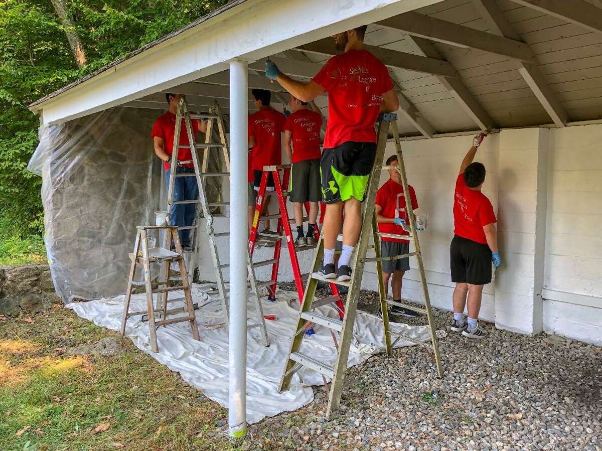 New Canaan Lions Club and NCHS SLOBs working together at the Lion's Den at Mill Pond on Sunday, Sept. 22.