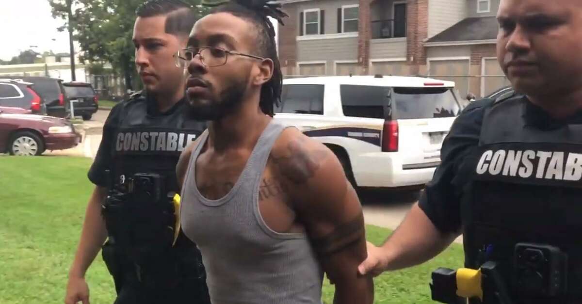 Javonte Darion Alexander, 22, is escorted by deputies with the Harris County Precinct 1 Animal Cruelty Division after being arrested for felony charge of animal cruelty. He has posted $10,000 bond. His next court setting is scheduled for Nov. 7.