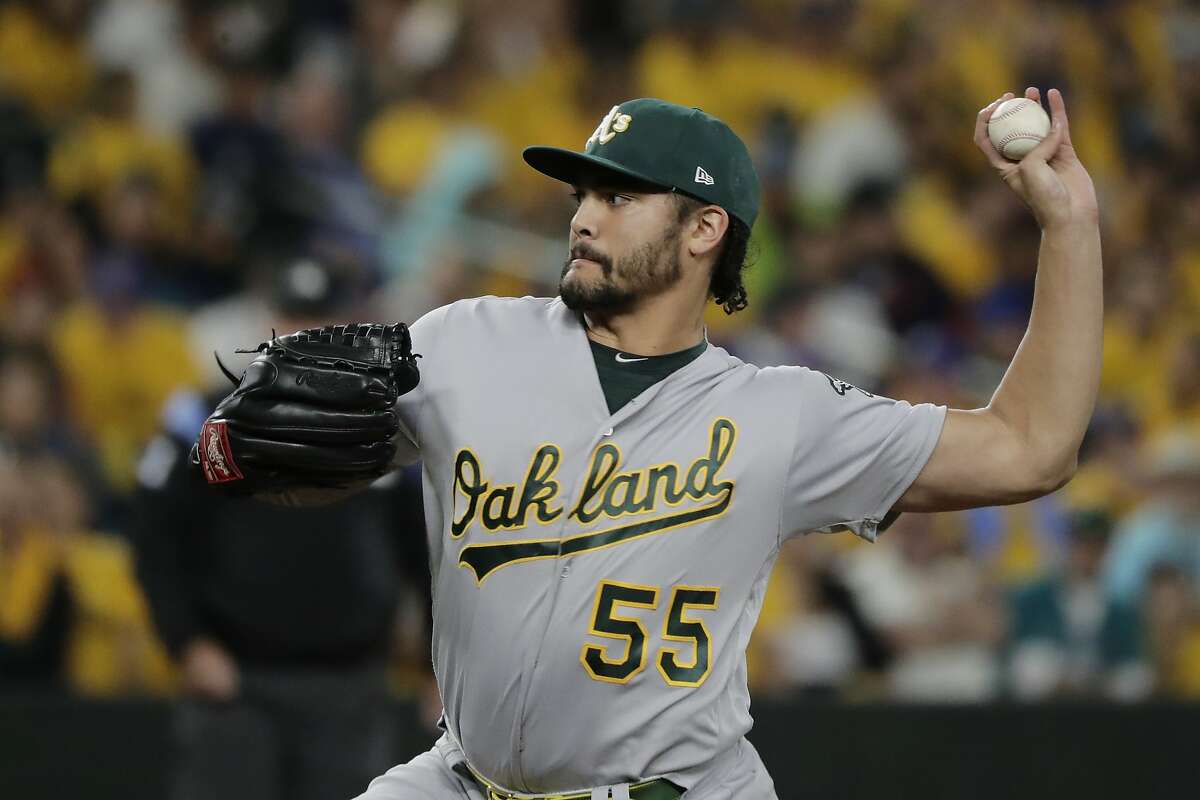 Oakland Athletics starting pitcher Sean Manaea throws to a Seattle Mariners batter during the first inning of a baseball game Thursday, Sept. 26, 2019, in Seattle. (AP Photo/Ted S. Warren)