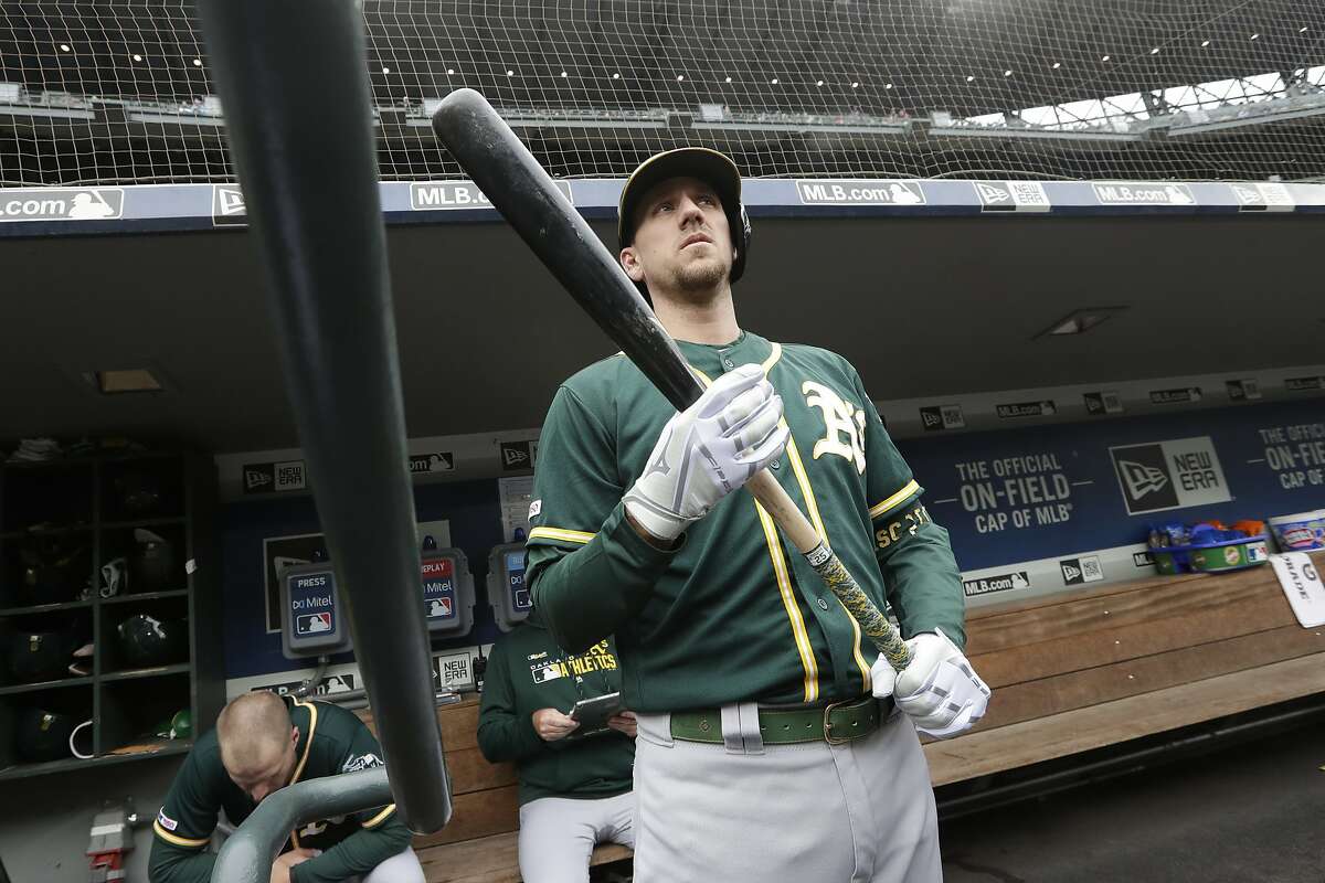Oakland Athletics' Stephen Piscotty looks out from the dugout before a baseball game against the Seattle Mariners Sunday, Sept. 29, 2019, in Seattle. The Mariners won 3-1. (AP Photo/Elaine Thompson)