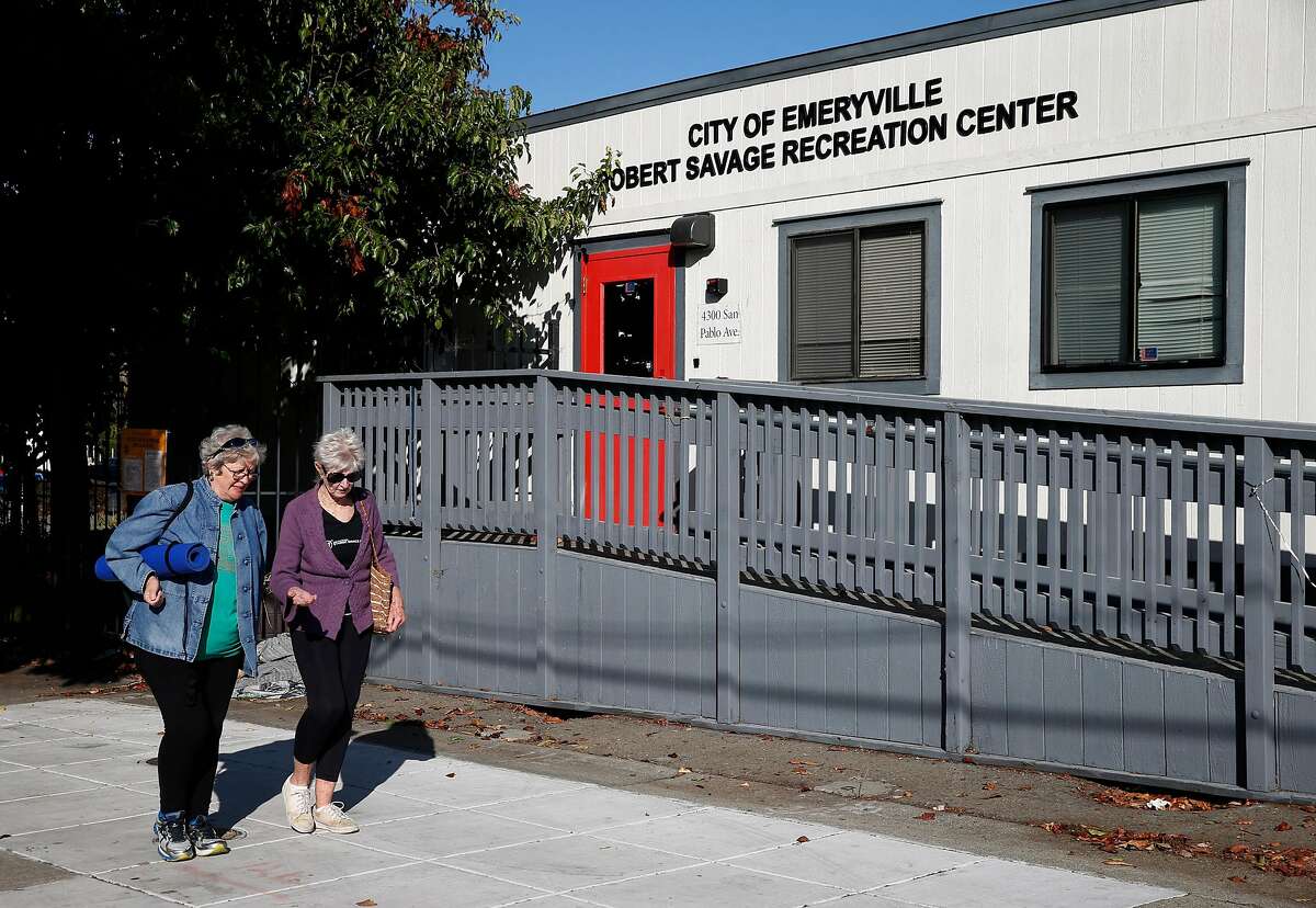 Pedestrians walk past the location of a future homeless family shelter at a former recreation center in Emeryville, Calif. on Tuesday, Oct. 1, 2019. As many as 20-25 families will be temporarily housed at the shelter when it opens in several months.