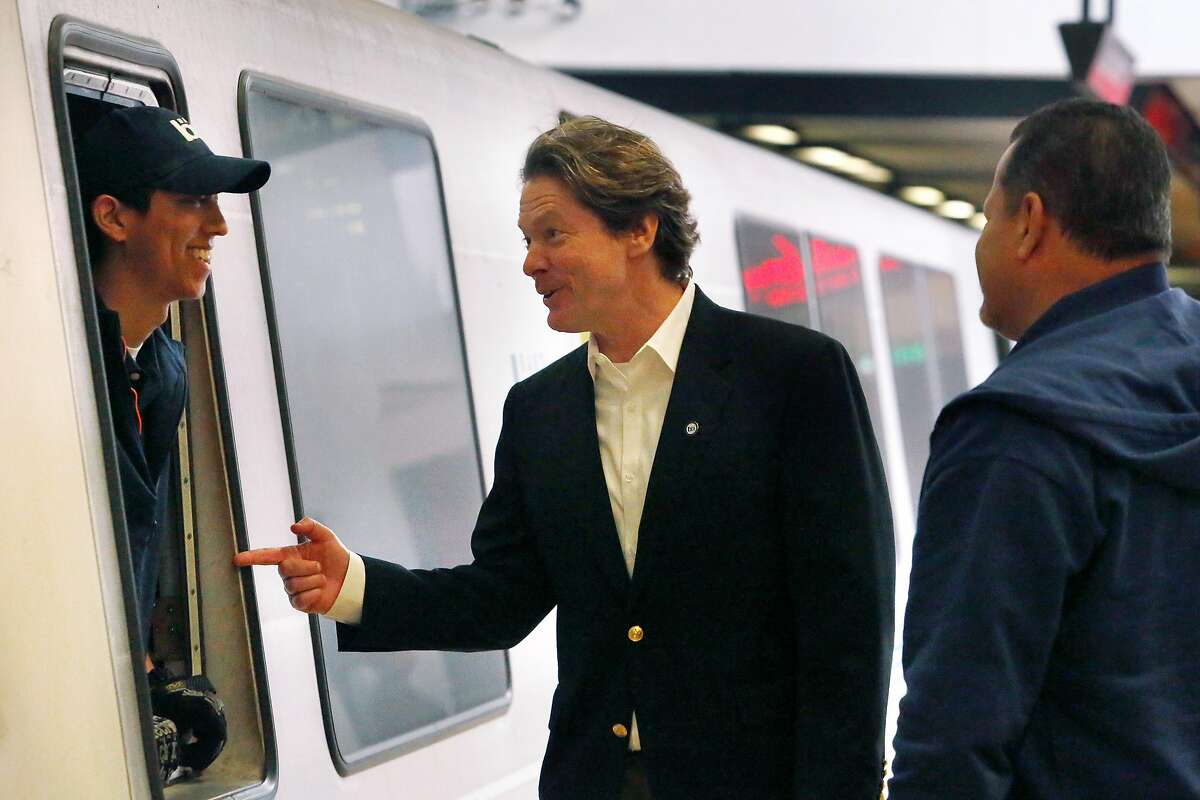 BART General Manager Robert Powers (center) talks with BART train operator Trevor Ho (left) after Powers disembarked at BART�s Lake Merritt Station on Monday, September 30, 2019 in Oakland, CA.