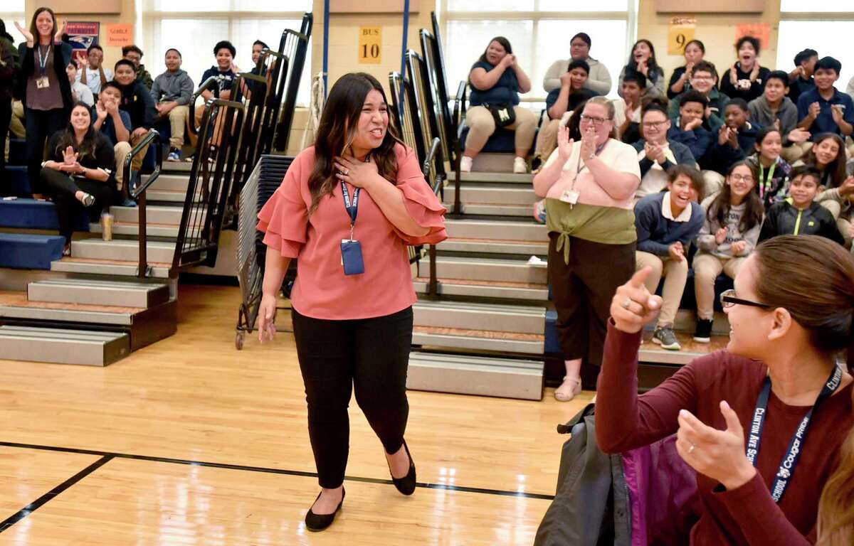 Clinton Avenue School teacher Lauren Sepulveda is surprised by an announcement during an assembly at the school Tuesday morning that she was given a Milken Family Foundation Milken Educator Award of $25,000 for being an exceptional teacher.