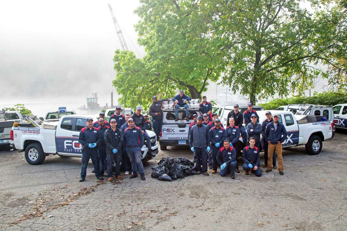 Employees from Fox Pest Control, an Oxford-based pest control company, spent time Friday, Sept. 27, picking up trash at Sunnyside Park.