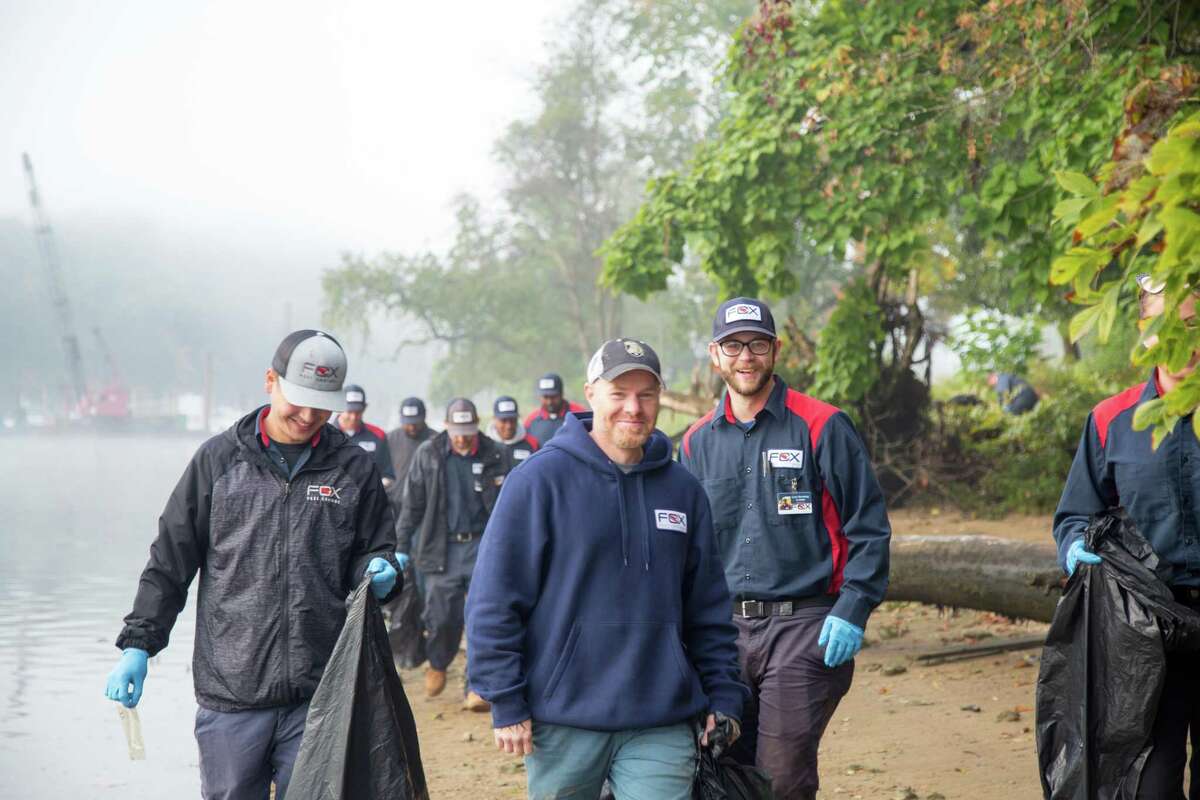 Employees from Fox Pest Control, an Oxford-based pest control company, spent time Friday, Sept. 27, picking up trash at Sunnyside Park.