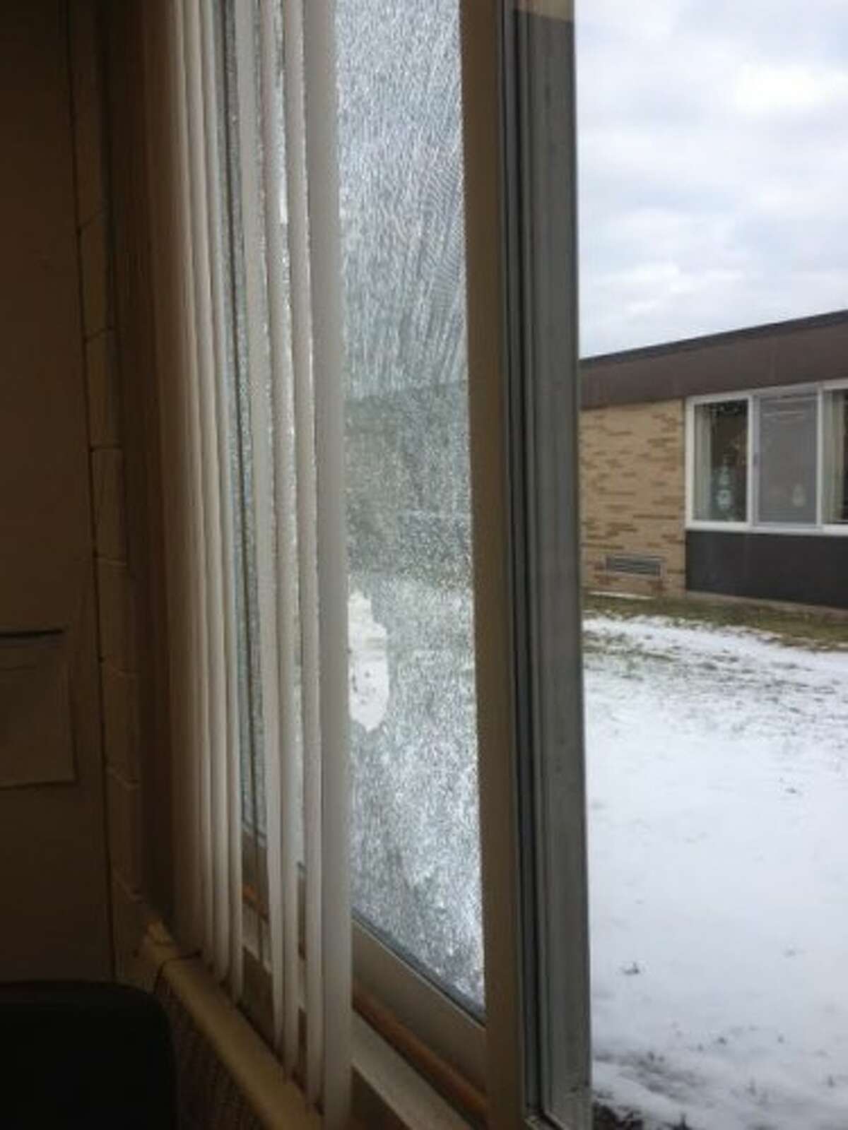 Four windows were shot out of Evart Elementary School during Thanksgiving break. Police are seeking information about the shooters. (Courtesy photo)