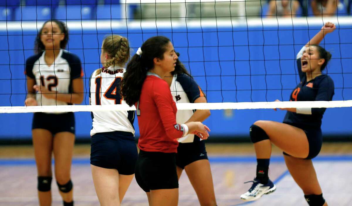 Brandeis Mia Munoz,far right celebrates with her team after scoring a point from the District 28-6A high school volleyball match between Brandeis and Stevens.on Tuesday, October 1, 2019.