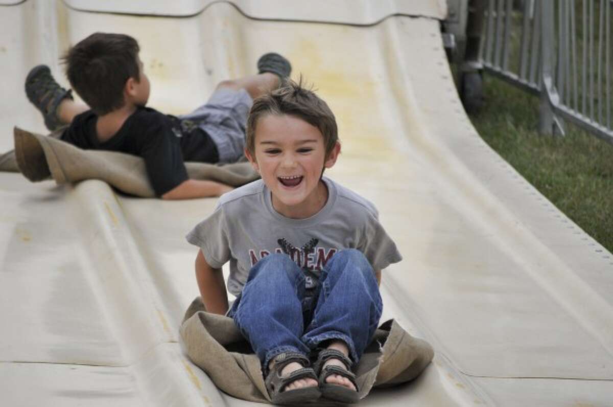 Kaden Worch enjoys the super slide on Thursday at the Manistee County Fair.
