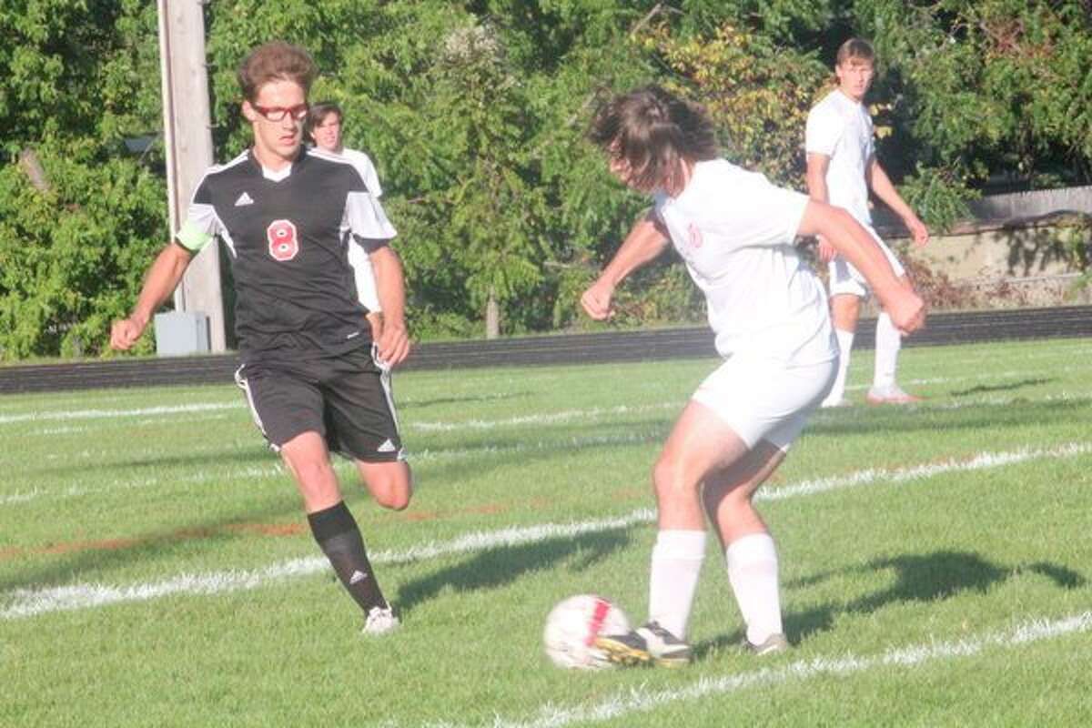 Reed City's Ty Brocker (8) goes after the ball against Big Rapids on Thursday. (Herald Review photo/John Raffel)