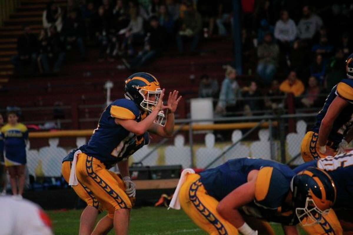 Evart quarterback Danny Witbeck gets ready to take the snap in recent action. (Herald Review/John Raffel)