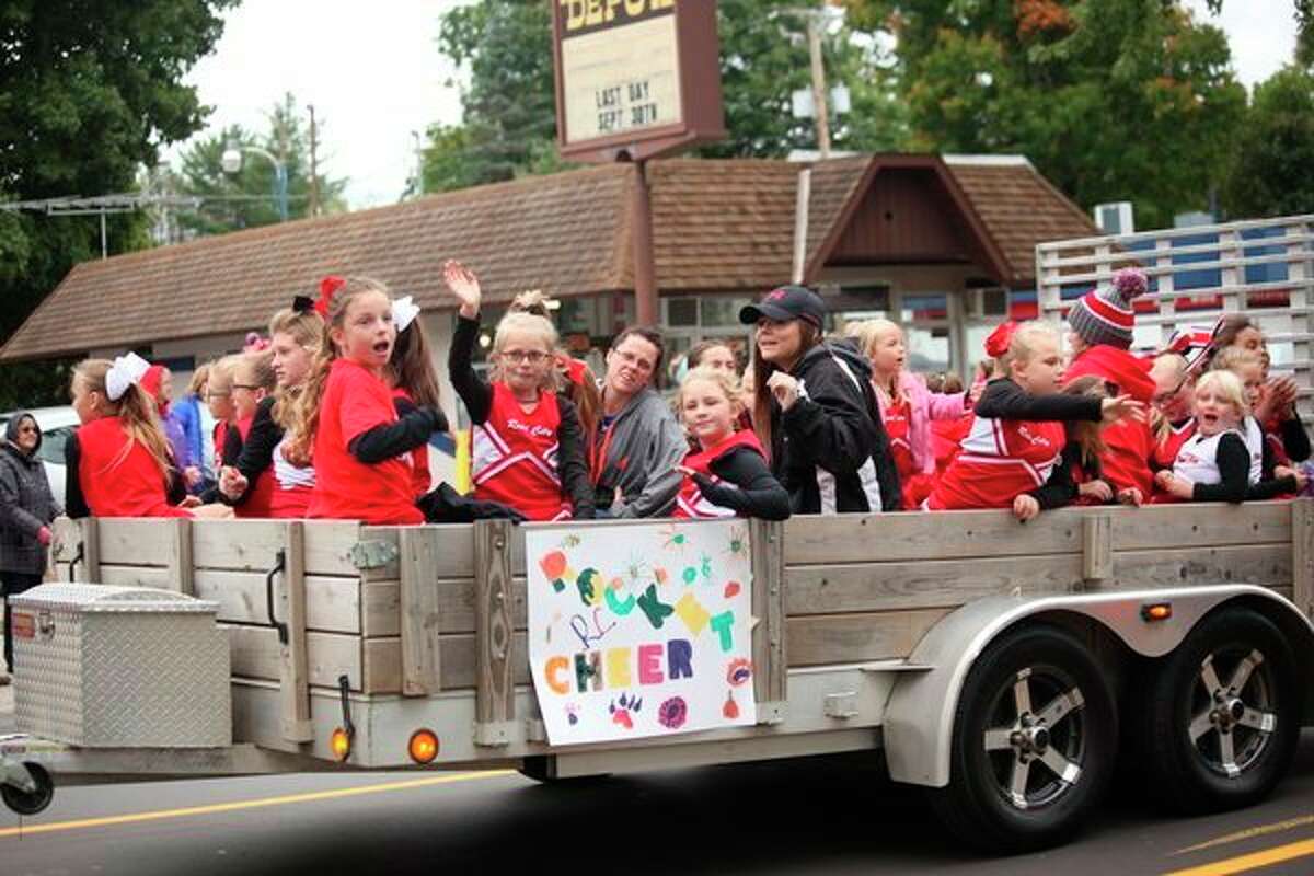 Cheerleaders ride past in their float at last year's RCAPS homecoming parade. This year, both EPS and RCAPS will have their parades on Friday, Oct. 11. (Herald Review file photo)