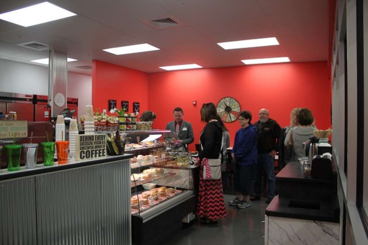 Benishek, Huizenga snowmobile through Manistee County