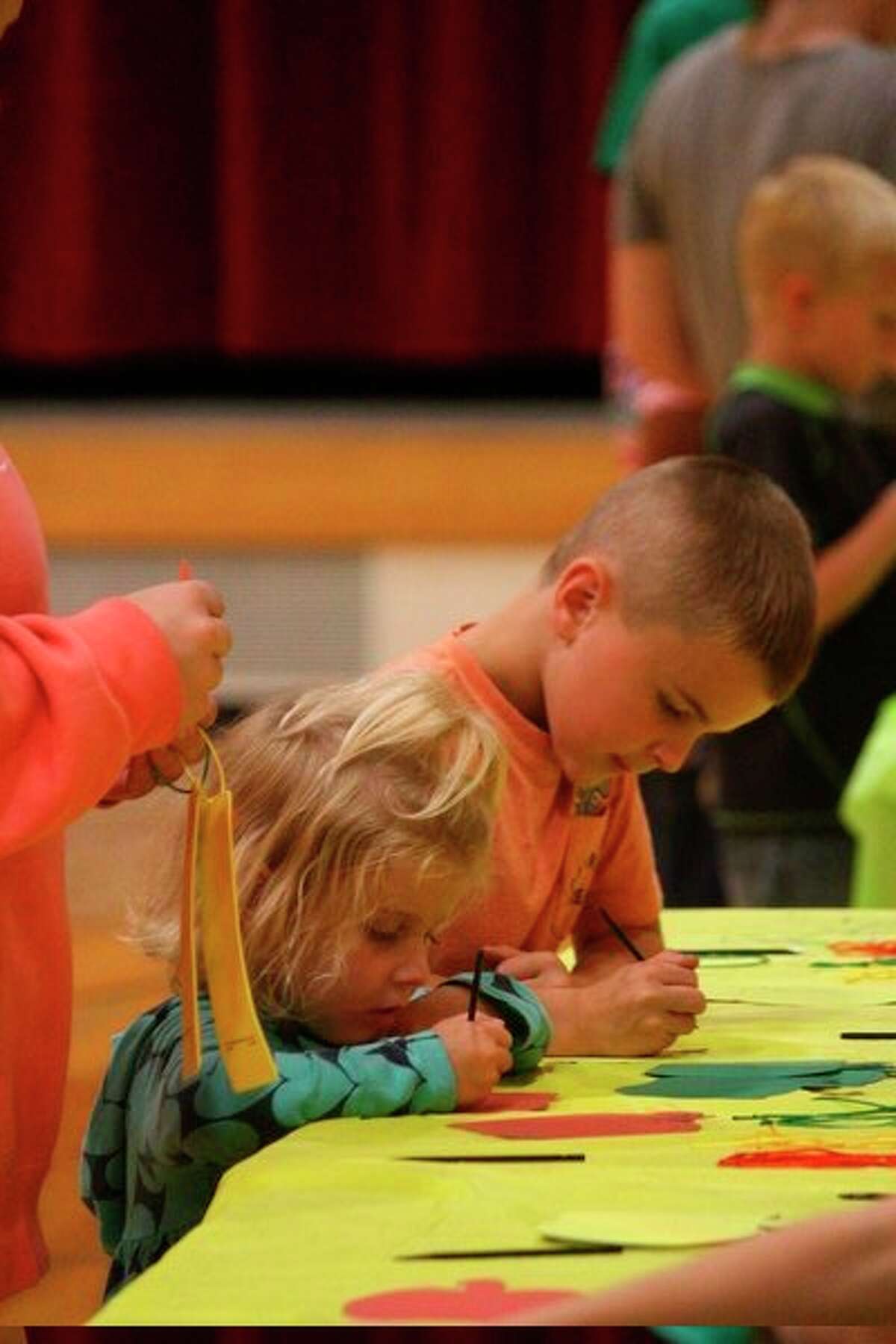 Local families were invited to G.T. Norman Elementary School Wednesday, Sept. 25, for Family Fun Night. The event began at 5 p.m., with pizza being served in the lunchroom. From 5:30 to 7 p.m., guests gathered in the gym to take part in a variety of games and activities. Local organizations, such as a local Boy Scouts troop and 4-H, also had tables set up at the event to speak with kids about various opportunities within the community. With Ferris State University students assisting, Spectrum Health also was on site to provide kids with free flu shots. They also set up a fun activity for kids to learn about healthy eating, giving students prizes for completing them. All students left the event with a free book as well. (Pioneer photos/ Catherine Sweeney)