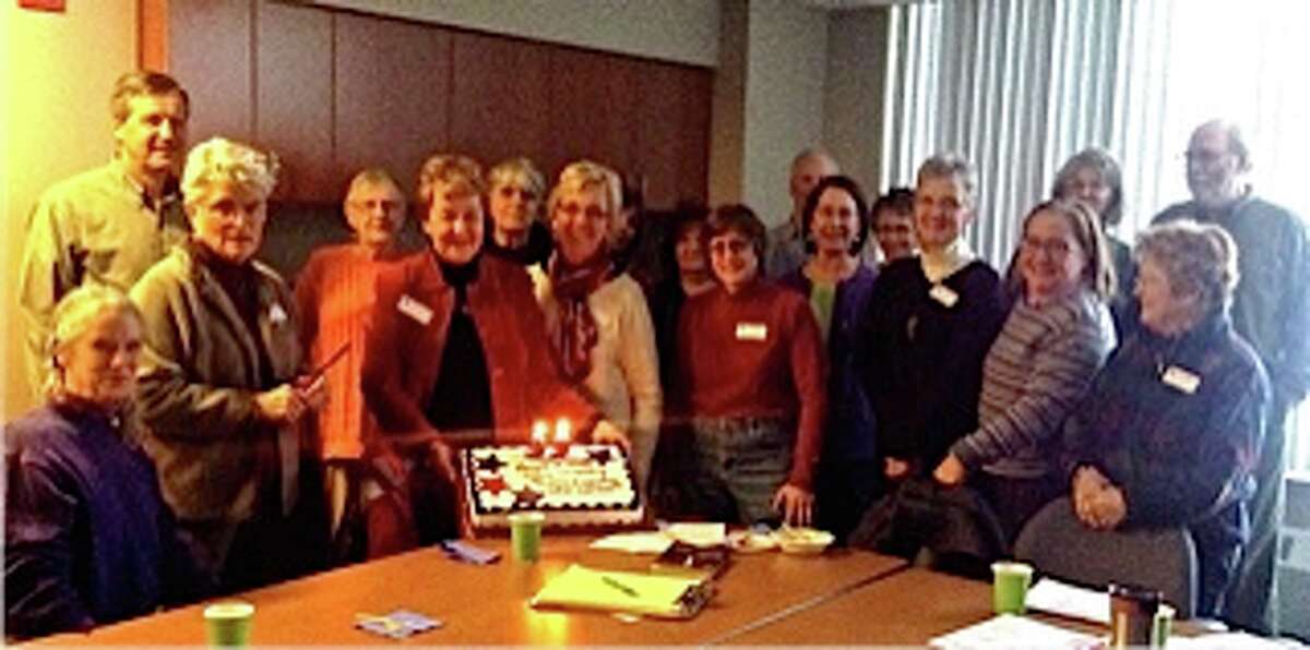 Nineteen members of the League of Women Voters Manistee County gathered on Thursday around the anniversary cake to celebrate the founding of the LWV on Feb.14, 1920, by Carrie Chapman Catt. (Courtesy photo)