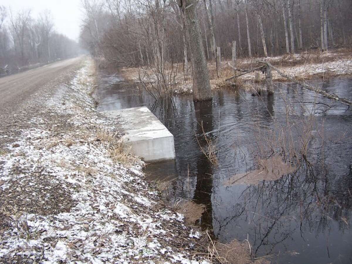 Water accumulates alongside Kettle Hole Road in the Kettle Hole Drain District in Stronach Township during spring 2014. (Courtesy photo/Thom Smith)