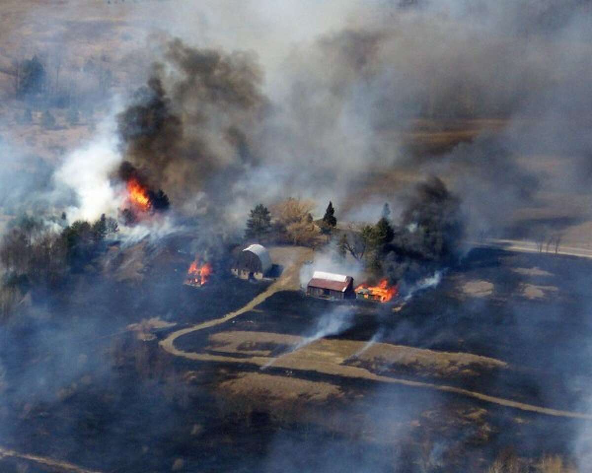 A wildfire burns 140 acres around Hoxeyville in 2008. This photo was taken from a U.S. Forest Service helicopter. (Courtesy photo)