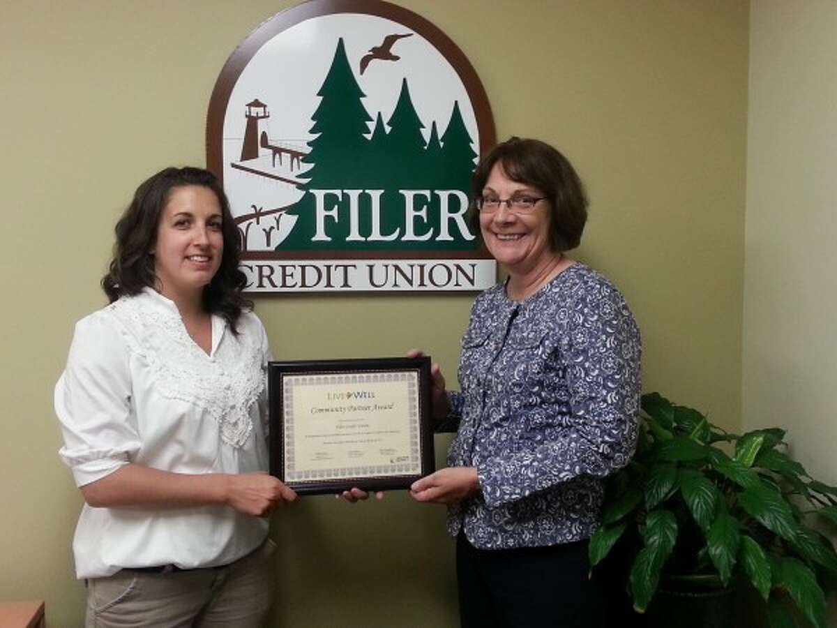 Kaci Kamaloski (left) and Patty Preuss accept the Live Well Community Partner Award for Filer Credit Union. (Courtesy Photo)