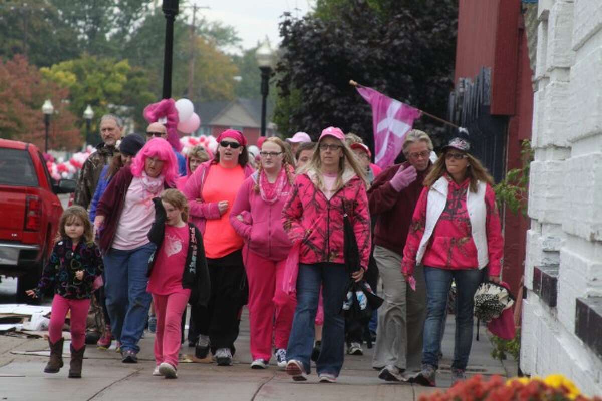 Participants in the Paint the Town Pink event walked down River Street as a group, showing support for the cause of fighting breast cancer. (Sean Bradley/News Advocate)