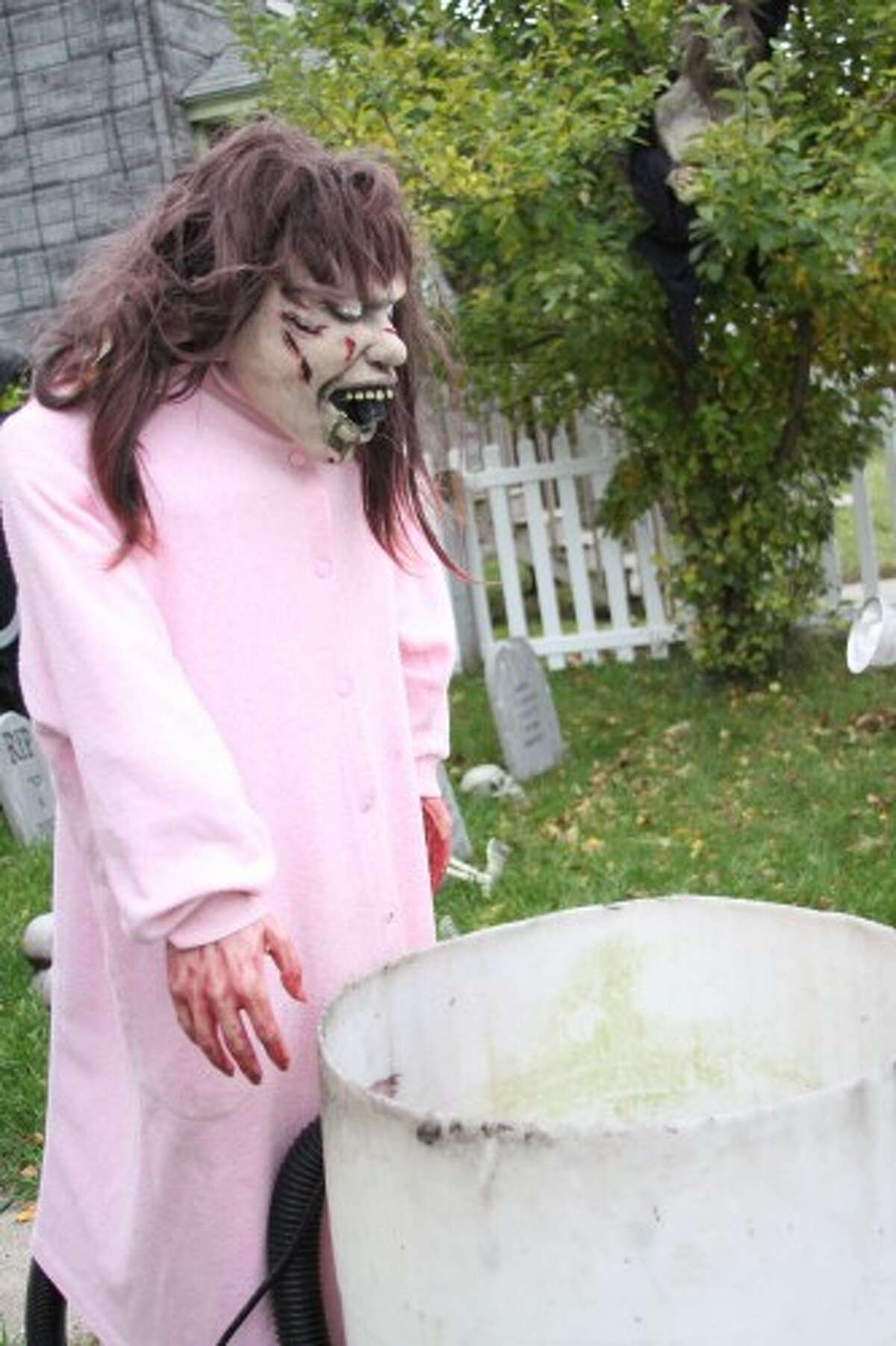 Inspired by the film The Exorcist, one of the Olen's attractions at their home is "the puker", a vomit spewing animatronic Halloween decoration. (Sean Bradley/News Advocate)