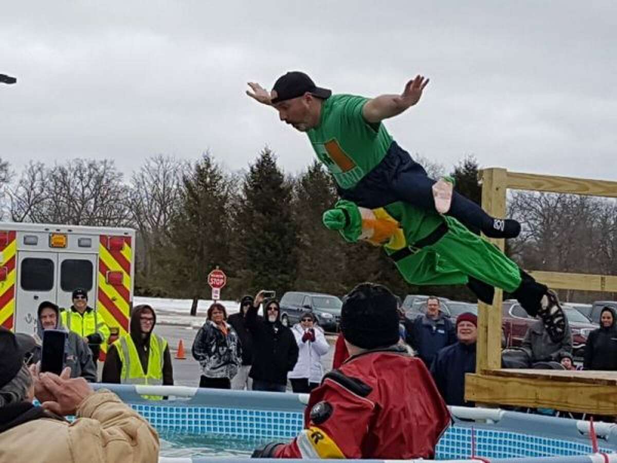The Manistee Polar Plunge was held on Saturday, with over 40 participants — many dressed in St. Patrick's Day themed costumes — braving the cold water. (Jane Bond/News Advocate)