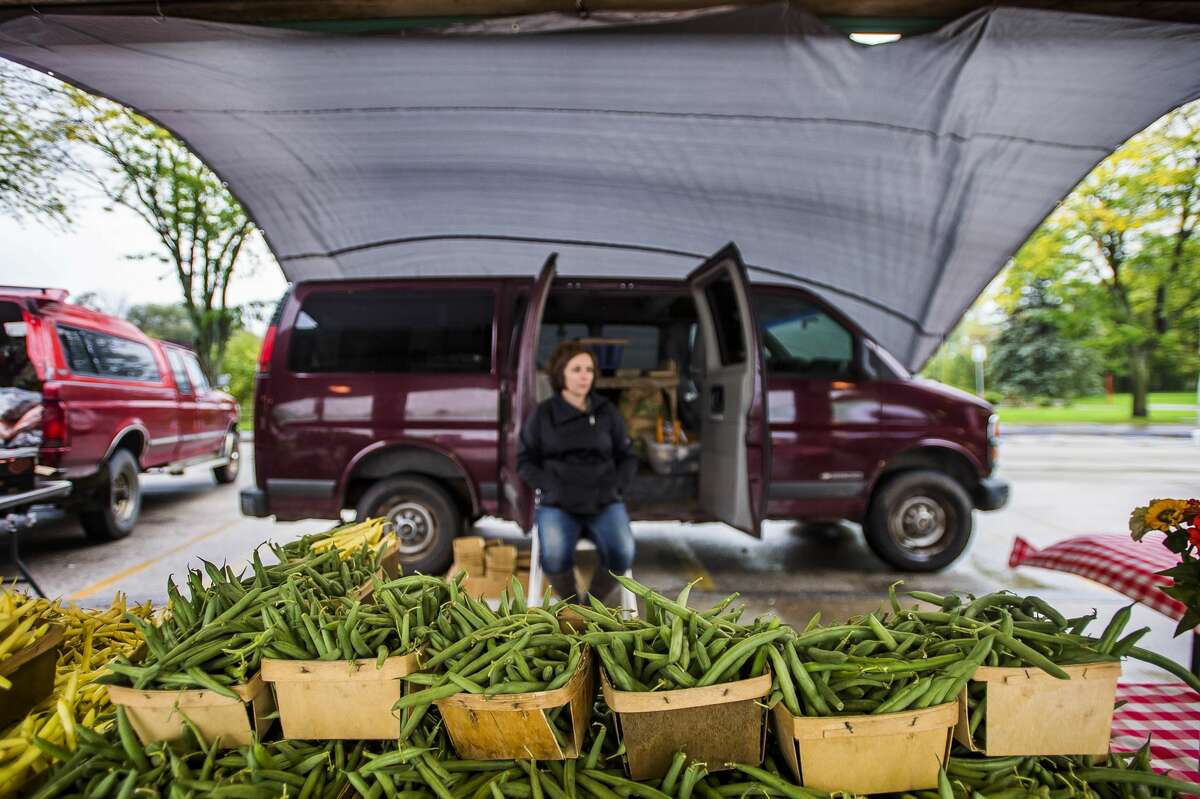 Green beans are displayed at the Bright Farm stand Wednesday, Oct. 2, 2019 at the Midland Area Farmers Market. (Katy Kildee/kkildee@mdn.net)