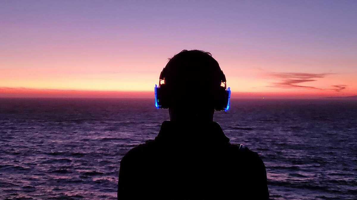 Bay Area locals hike through Land’s End with wireless headphones as part of a silent hike series put on by composer Murray Hidary.