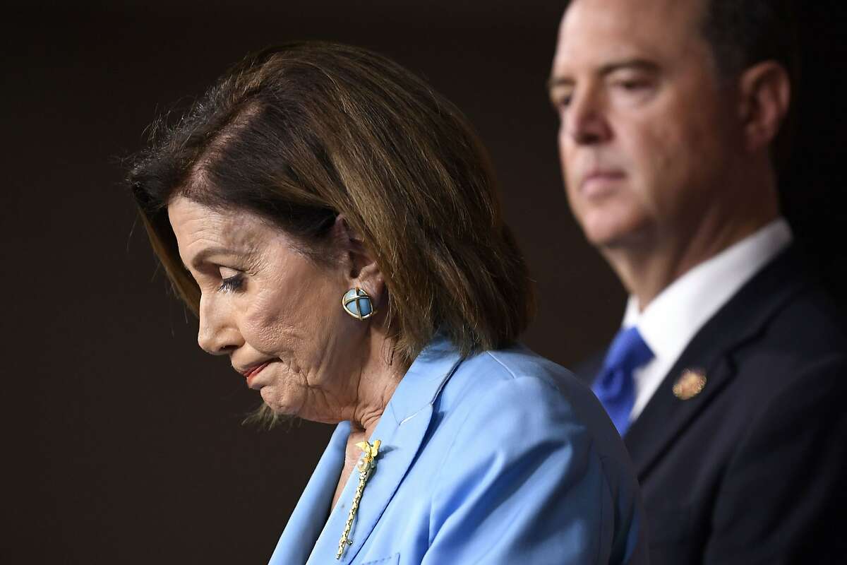 House Speaker Nancy Pelosi of Calif., left, joined by House Intelligence Committee Chairman Rep. Adam Schiff, D-Calif., right, arrive for a news conference on Capitol Hill in Washington, Wednesday, Oct. 2, 2019 (AP Photo/Susan Walsh)