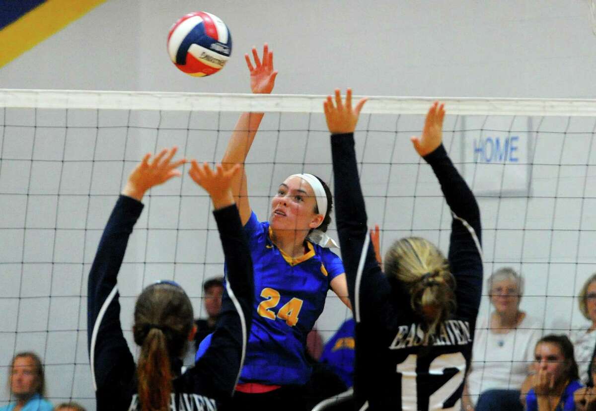 Seymour's Faith Rousseau spikes the ball during girls volleyball against East Haven in Seymour, Conn., on Thursday Sept. 26, 2019.