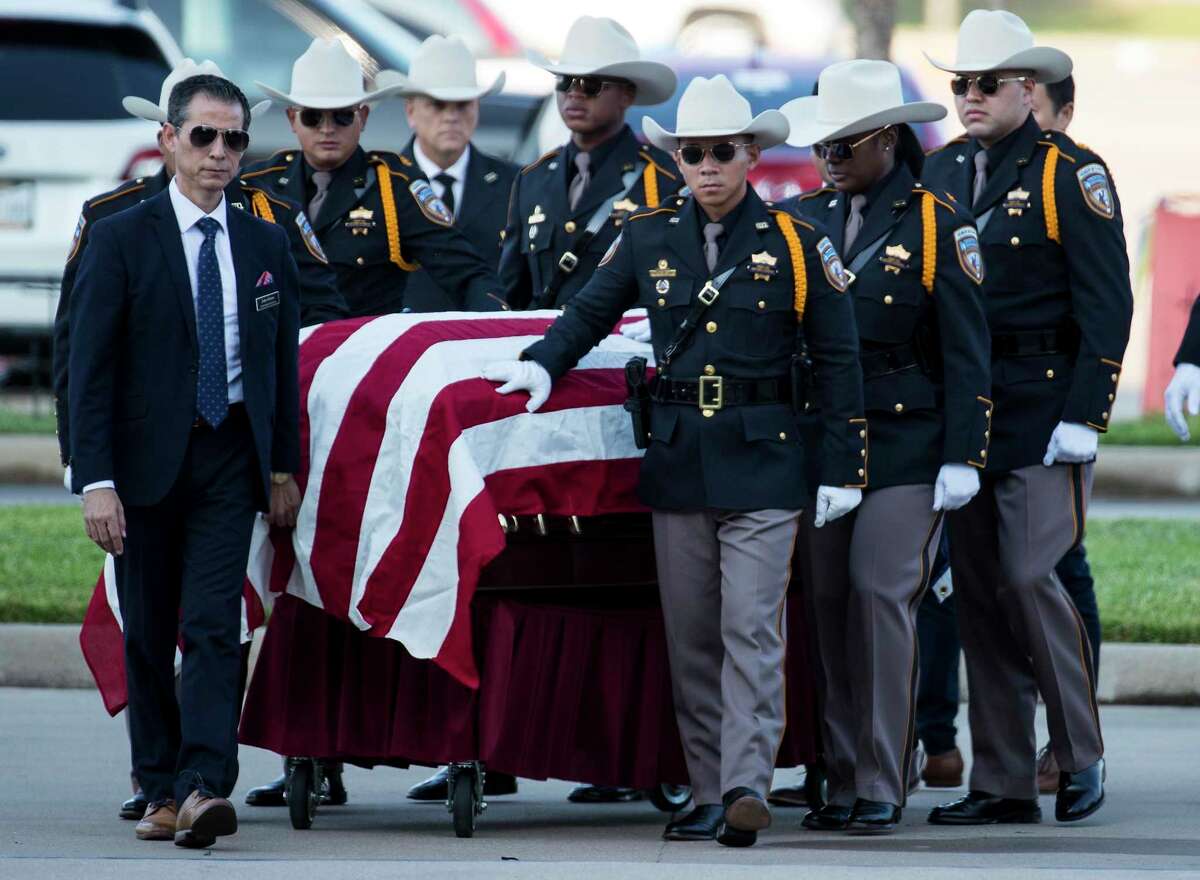 An honor guard escorts the casket of Harris County Sheriff's Deputy Sandeep Dhaliwal for his funeral at Berry Center on Wednesday, Oct. 2, 2019, in Houston. Dhaliwal was killed in the line of duty Friday, when he was shot and killed during a traffic stop.