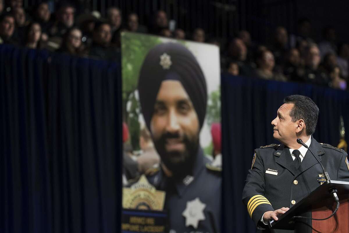 Harris County Sheriff Ed Gonzalez looks up at his District 5 deputies as he eulogizes deputy Sandeep Dhaliwal during the slain deputy's funeral at Berry Center on Wednesday, Oct. 2, 2019, in Houston. Dhaliwal was killed in the line of duty Friday, when he was shot and killed during a traffic stop.