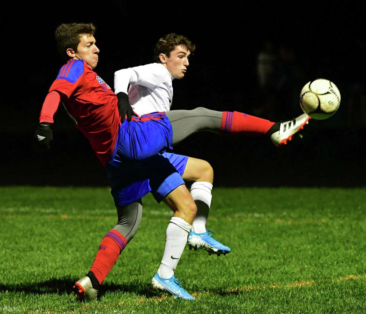 South Glens Falls' Justin Nesbitt, left, battles for the ball with Queensbury's Teddy Borgos during a soccer game on Wednesday, Oct. 2, 2019. The Suburban Council schools won't be able to start their season before March 1. (Lori Van Buren/Times Union)
