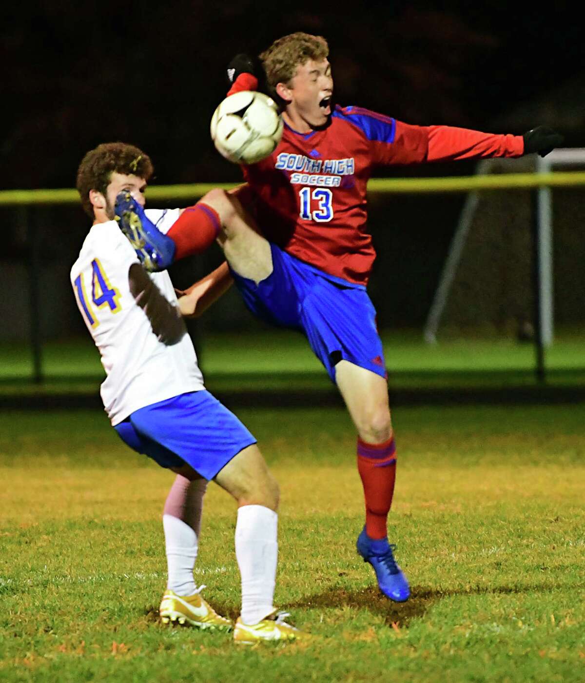 Queensbury's Lucas McCane, left, battles for the ball with South Glens Falls' Andrew King during a soccer game on Wednesday, Oct. 2, 2019. This school year's season has been pushed to spring. (Lori Van Buren/Times Union)