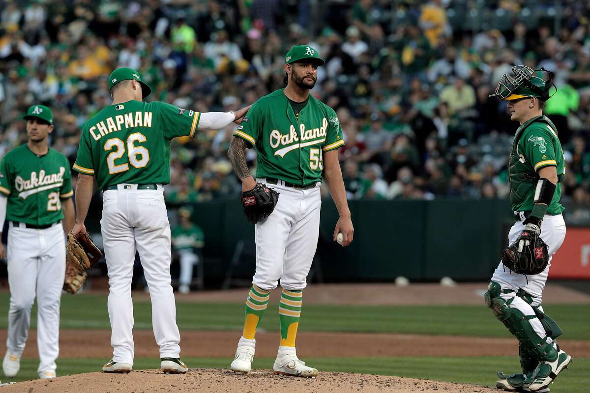 Sean Manaea (55) waits on the mound to be relieved by manager bob Melvin in the third inning as the Oakland Athletics played the Tampa Bay Rays at the Oakland Coliseum in the AL Wild Card playoff game in Oakland, Calif., on Wednesday, October 2, 2019.