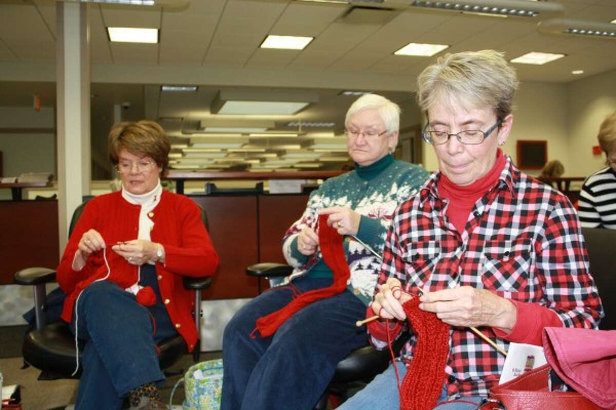 Pictured, (from left) Cheryl Schweitzer, June O'Hara and Mary Jo Proctor work on their scarves. (Pioneer photo/Candy Allan)