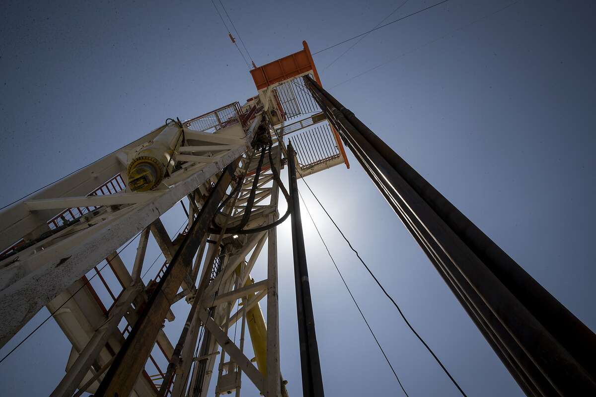 A drilling rig drills a well named "Queen" on Friday, Aug. 23, 2019, near Malaga, N.M. Mewbourne Oil Company named the well after the band.