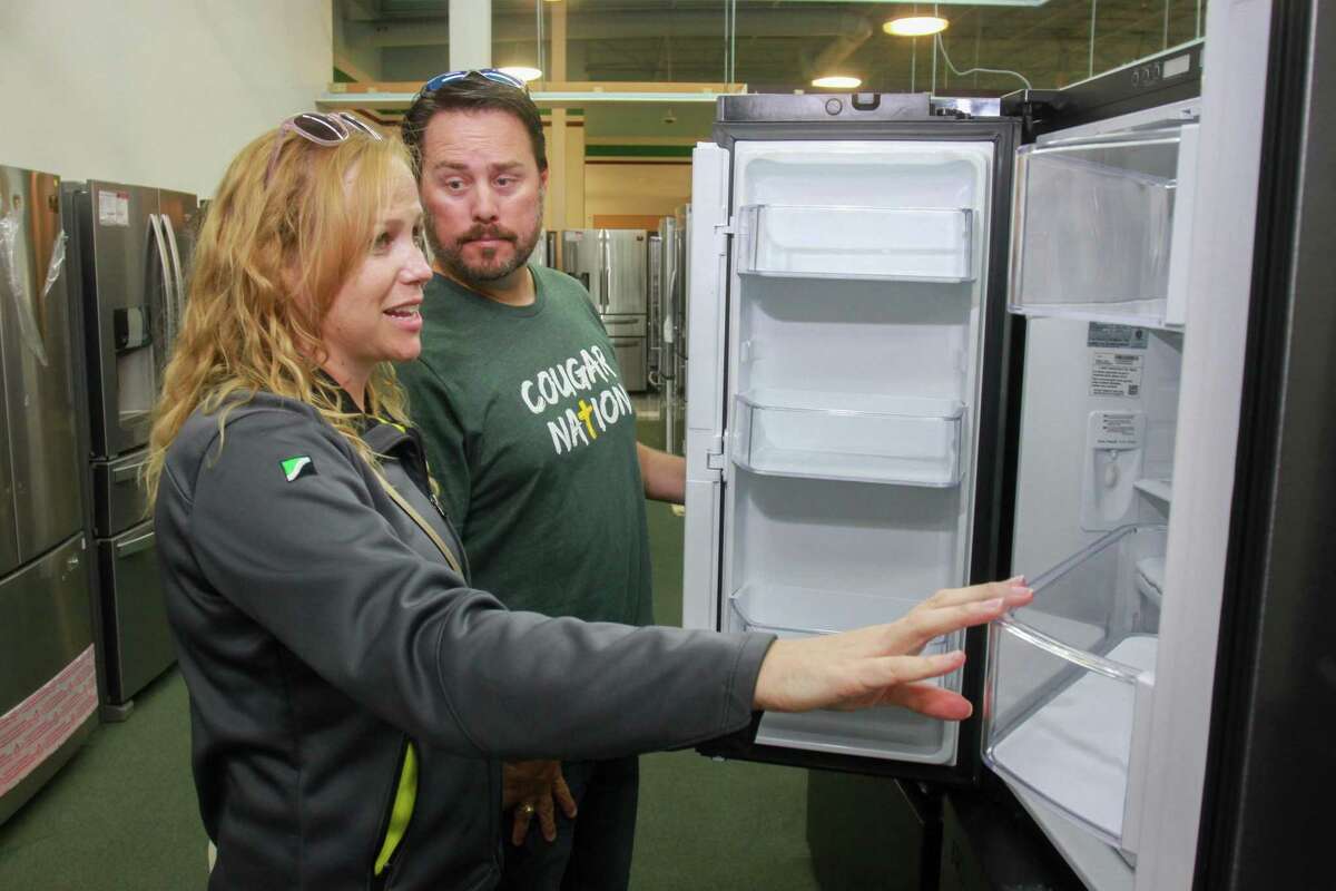 Dallas and Sarah Lusk shopping refrigerators at the first Best Buy Outlet store. The store offers open-box appliances, TVs and electronics at a discount of up to 60 percent, opened recently on Tomball Pkwy. September 27, 2019.