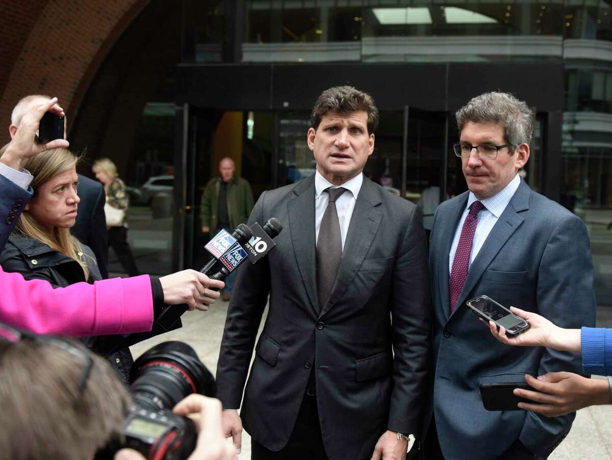 Greenwich attorney Gordon Caplan, left, speaks beside his attorney Joshua Levy after his sentencing at the John Joseph Moakley United States Courthouse in Boston on Thursday, Oct. 3, 2019. Caplan was sentenced to one month in prison for paying $75,000 to improve his daughter's scores on a college admissions test. He was busted as part of the Varsity Blues federal sting operation that ensnared 50 people in crimes involving bribery and manipulating college entrance exam scores.