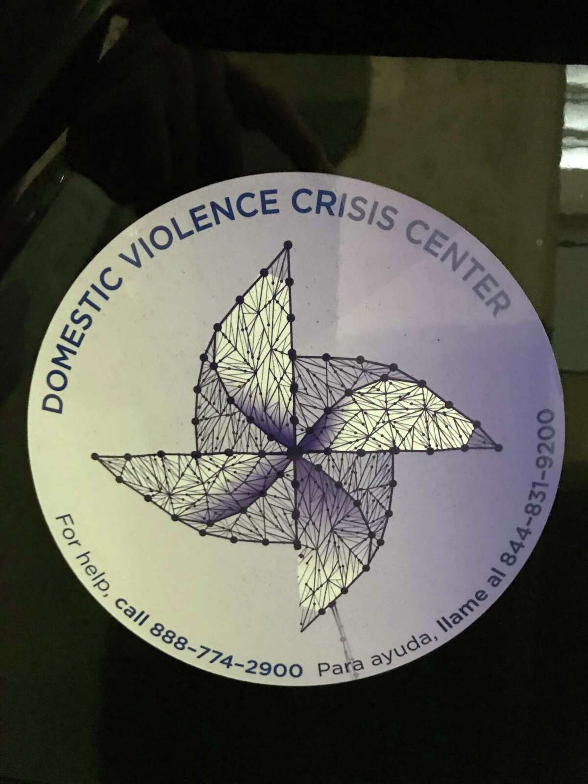 Stamford Police are showing their support for Domestic Violence Awareness Month by outfitting their cruisers with magnets advertising contact numbers for the Domestic Violence Crisis Center on Summer Street.