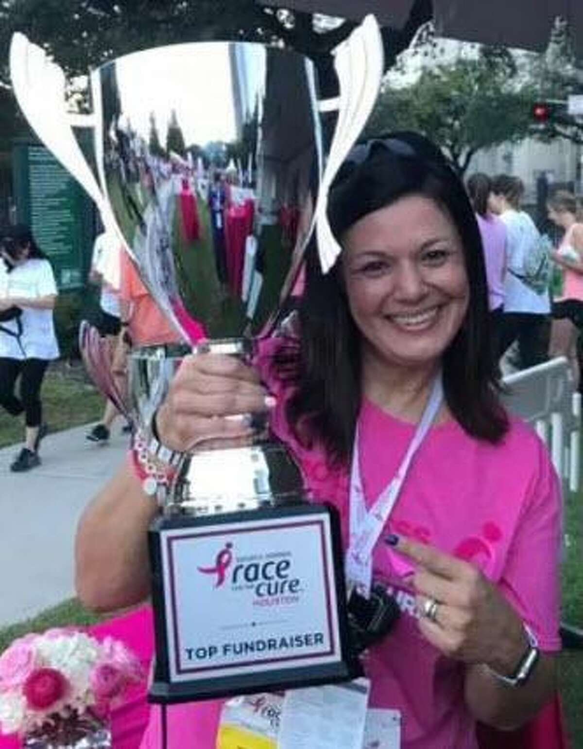 Cindy Saenz receives recognition for her fundraising on behalf of the Susan G. Komen Race for the Cure Houston.
