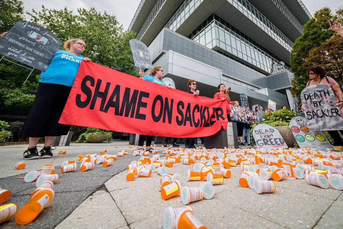 Members of P.A.I.N. (Prescription Addiction Intervention Now) and Truth Pharm staged a protest on Sept. 12, 2019 outside Purdue Pharma’s headquarters at 201 Tresser Blvd., in downtown Stamford, Conn.