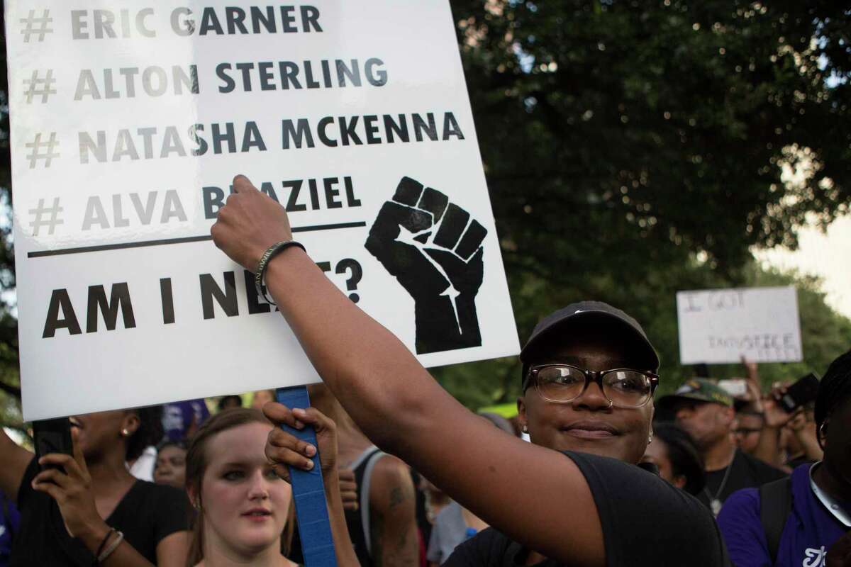 A Black Lives Matter protestor demonstrated against police brutality demanding the names of the victims to be mentioned at a 2016 rally in Houston.