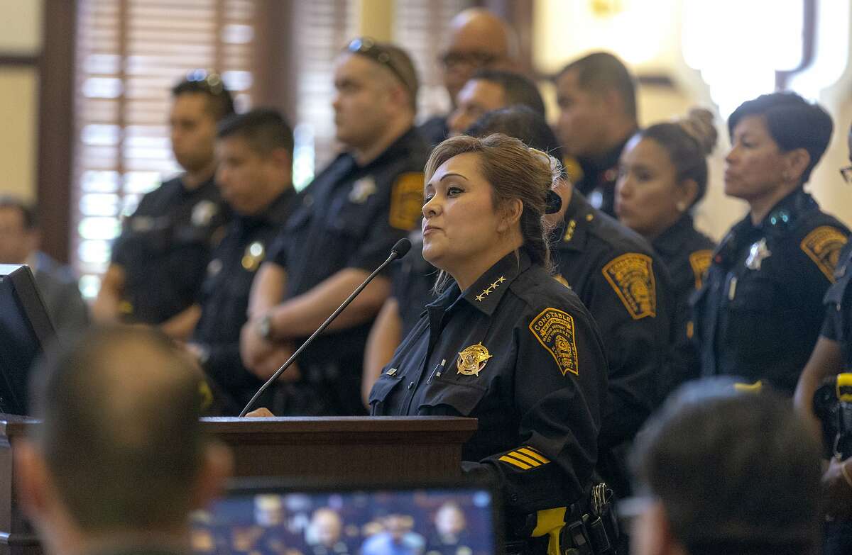 Backed by her deputy constables, Precinct 2 Constable Michelle Barrientes Vela, speaks Tuesday, May 21, 2019 before the Bexar County Commissioners during the citizens' comment period of the commissioners' meeting at the Bexar County Courthouse. Constable Vela has been accused of shaking down residents for cash at a county park on Easter Sunday.