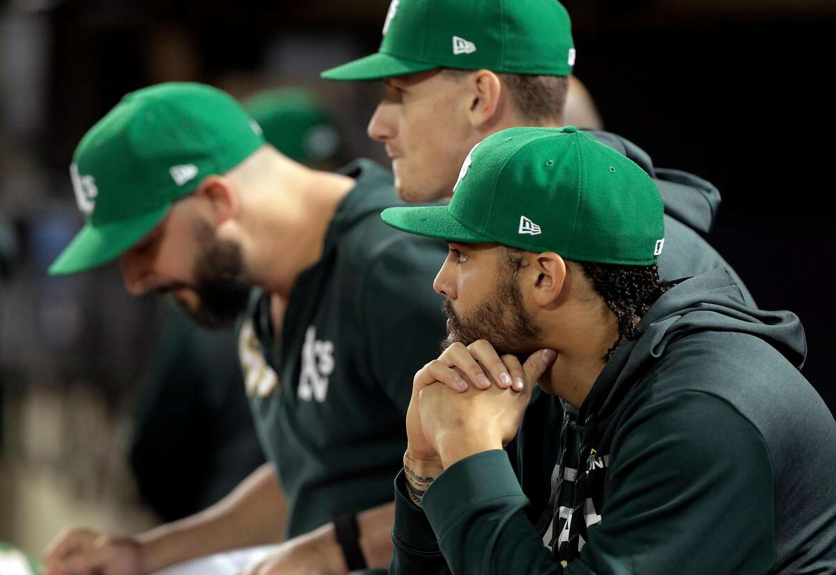 Sean Manaea (55) watches from the dugout as the Oakland Athletics played the Tampa Bay Rays at the Oakland Coliseum in the AL Wild Card playoff game in Oakland, Calif., on Wednesday, October 2, 2019. The Rays defeated the A’s 5-1.